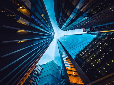 Looking directly up at the skyline of the financial district in central London