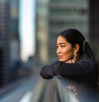 A portrait of a beautiful businesswoman in the city.